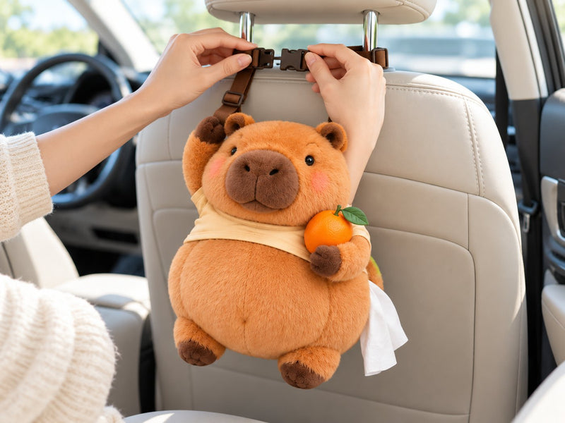 Hands buckling Capy's straps around a car headrest
